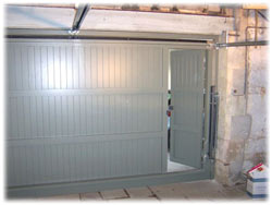 rear of double Cedar Door timber garage door with inbuilt wicket door